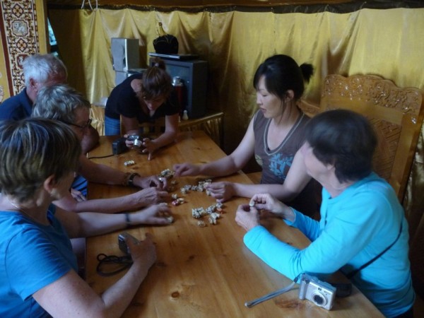 Uryungar our Mongolian guide showing us how to play knucklebones